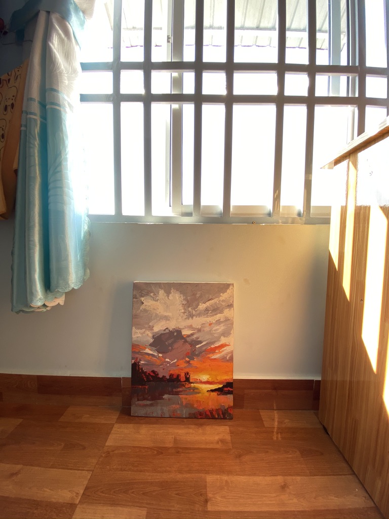 Oil painting of a glowing sunset over water