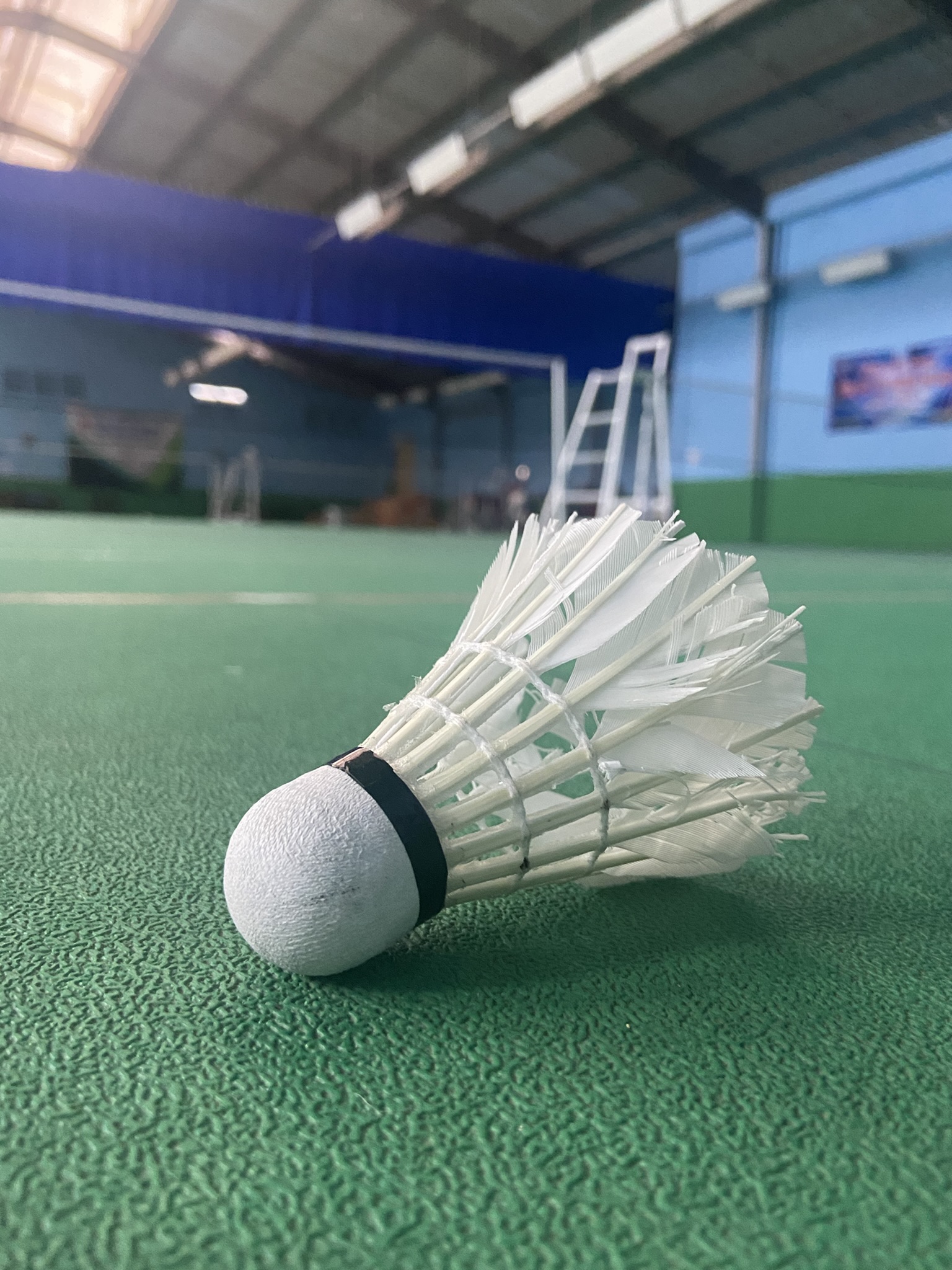 A badminton match in progress